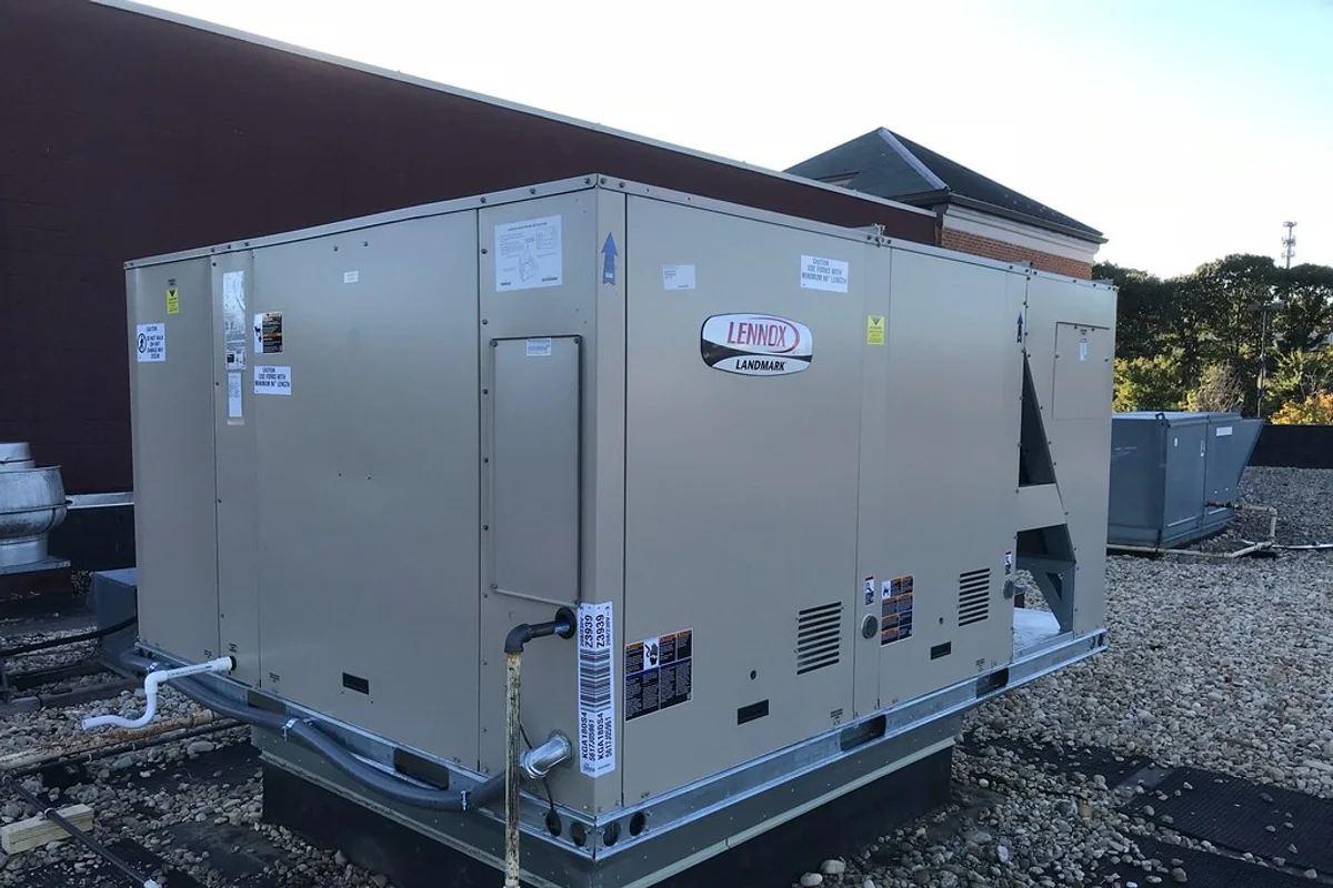 A large packaged air conditioning and HVAC unit installed on a building rooftop.
